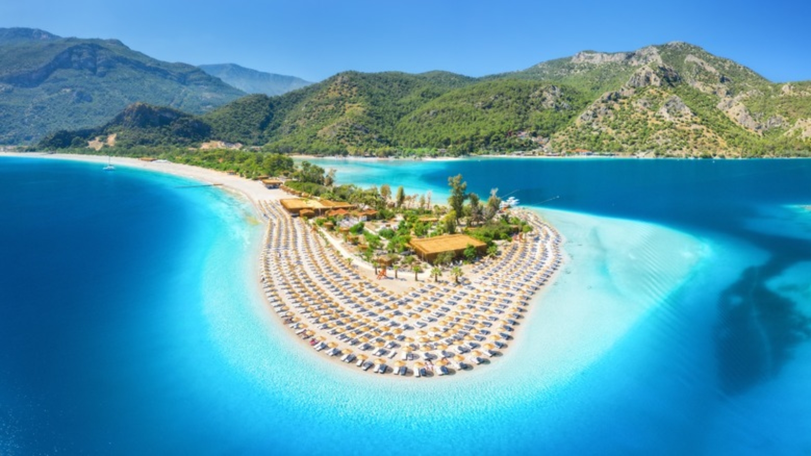 Aerial,View,Of,Sea,Bay,,Sandy,Beach,With,Umbrellas,,Trees,